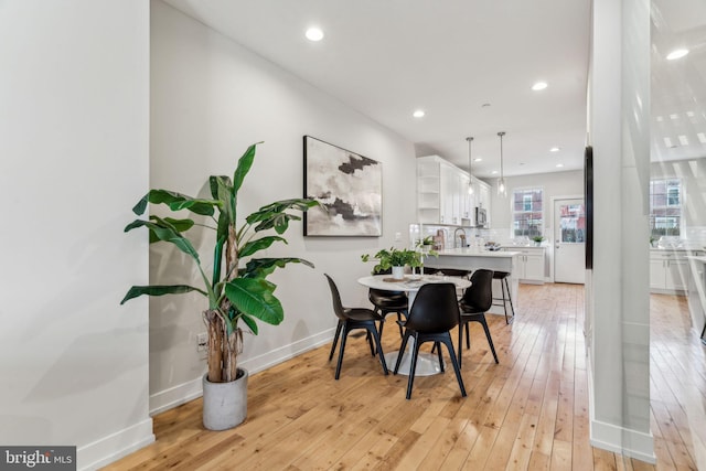 dining area with light hardwood / wood-style flooring