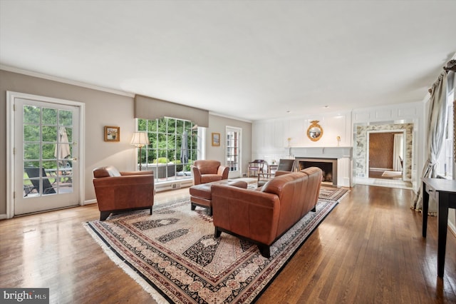 living room featuring crown molding and hardwood / wood-style floors