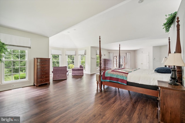 bedroom featuring dark hardwood / wood-style flooring and vaulted ceiling