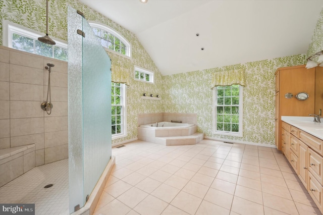 bathroom with vanity, vaulted ceiling, tile patterned floors, and independent shower and bath