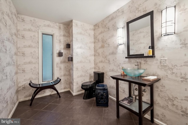 bathroom with tile patterned floors, sink, and toilet