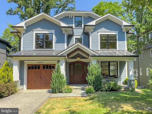 view of front facade with a front yard and a garage