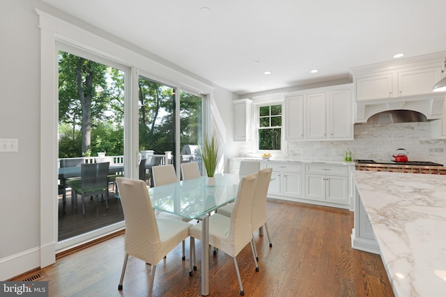 dining room with dark hardwood / wood-style flooring