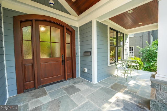 entrance to property featuring covered porch