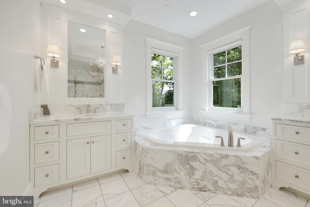 bathroom with vanity and separate shower and tub