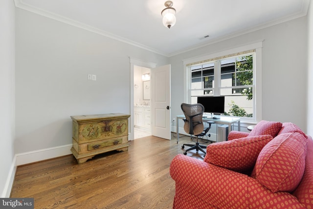 office with hardwood / wood-style flooring and ornamental molding