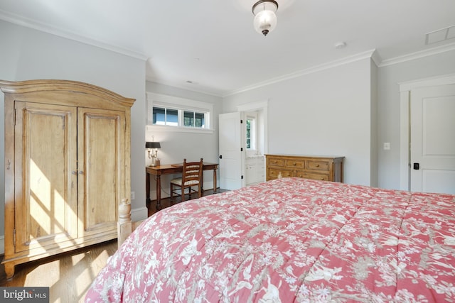 bedroom with crown molding