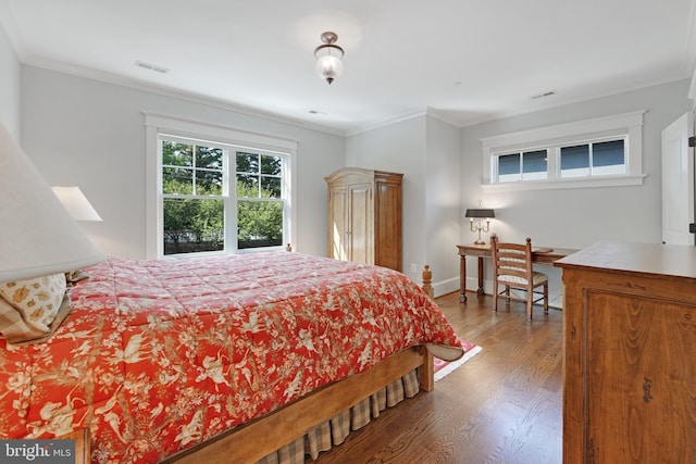 bedroom featuring hardwood / wood-style flooring and ornamental molding