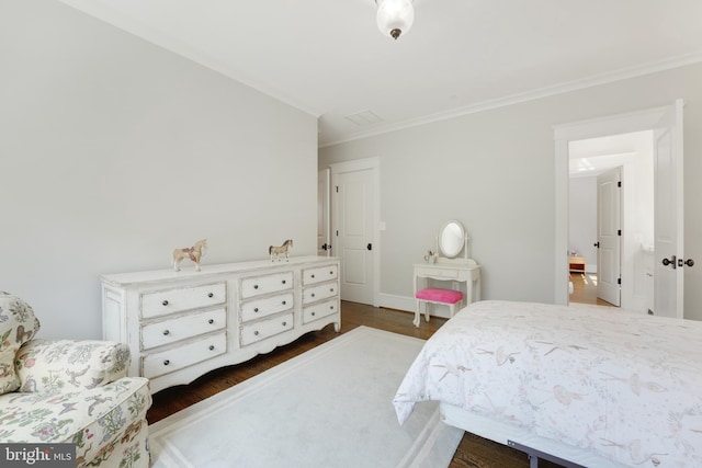 bedroom featuring dark wood-type flooring and ornamental molding