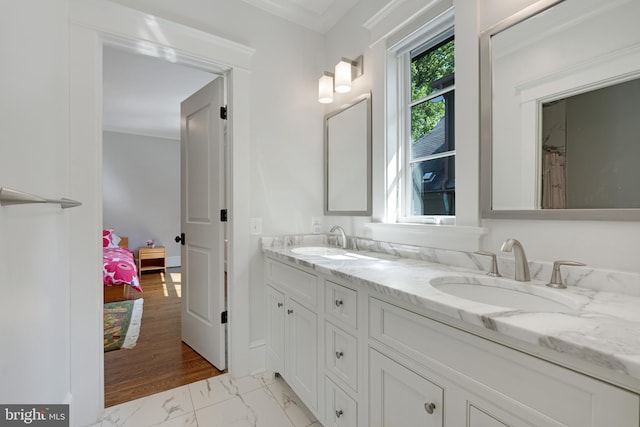 bathroom featuring vanity and crown molding