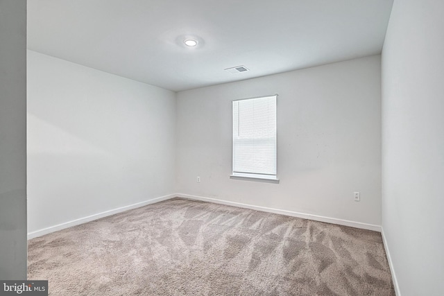 spare room with carpet floors