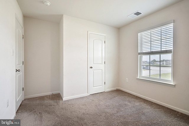 unfurnished bedroom featuring carpet