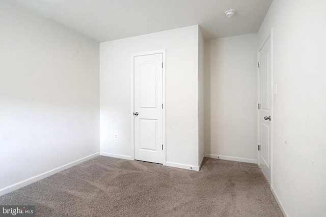 unfurnished bedroom with carpet floors