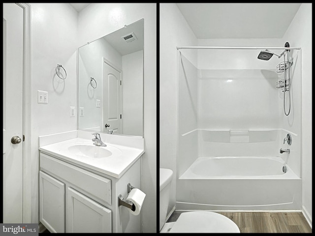 full bathroom with vanity, hardwood / wood-style floors, shower / bathing tub combination, and toilet