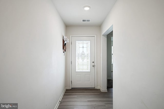 doorway to outside with wood-type flooring