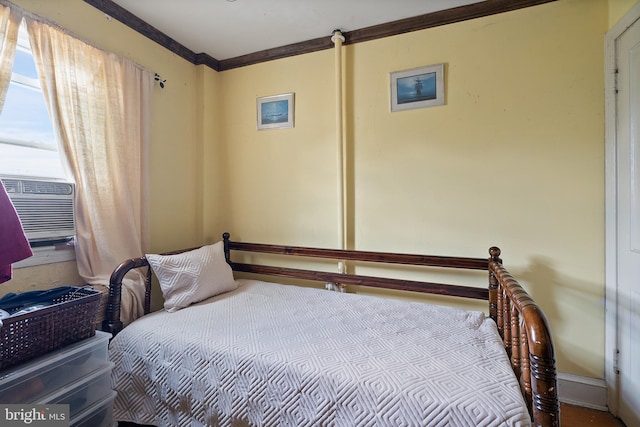 bedroom with cooling unit and ornamental molding