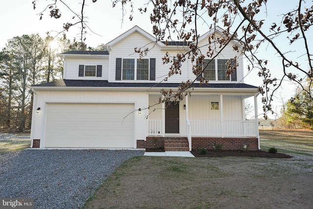 view of front of home featuring a front lawn and a garage