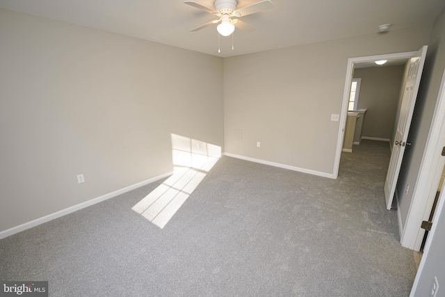 interior space featuring ceiling fan and carpet floors