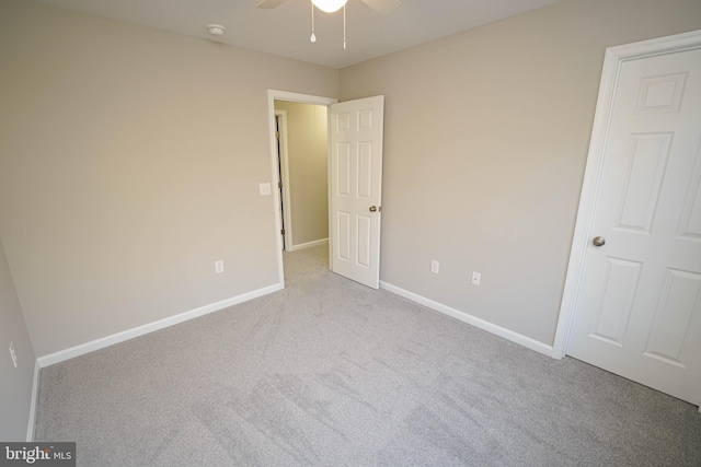 unfurnished bedroom with light carpet and ceiling fan