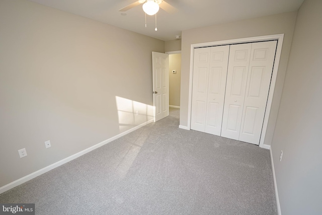 unfurnished bedroom featuring ceiling fan, carpet floors, and a closet