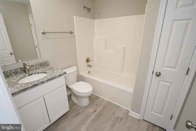 full bathroom with wood-type flooring, vanity, toilet, and shower / tub combination