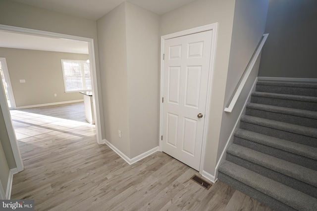 stairway featuring hardwood / wood-style floors