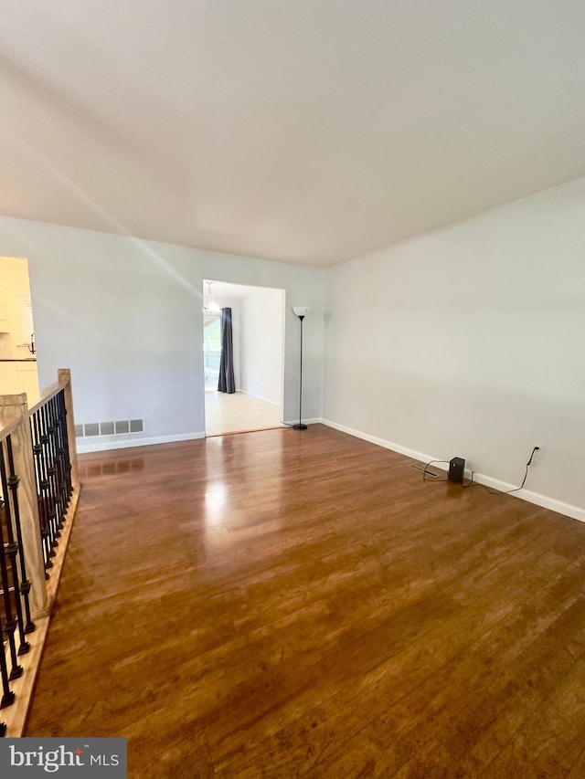 spare room featuring dark hardwood / wood-style floors