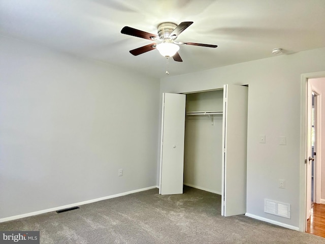 unfurnished bedroom featuring ceiling fan, carpet flooring, and a closet