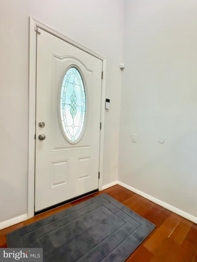 foyer with dark wood-type flooring