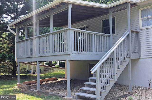 view of side of property featuring a wooden deck