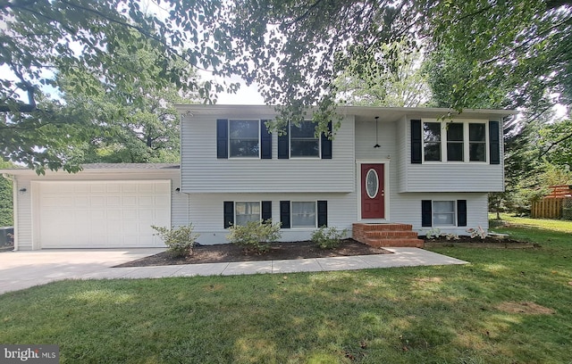 bi-level home with a garage and a front yard