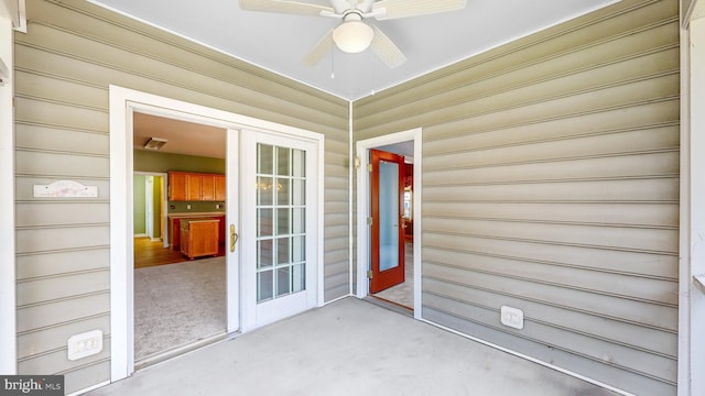 exterior space with ceiling fan