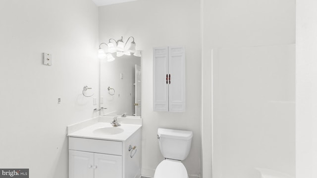 bathroom with vanity and toilet