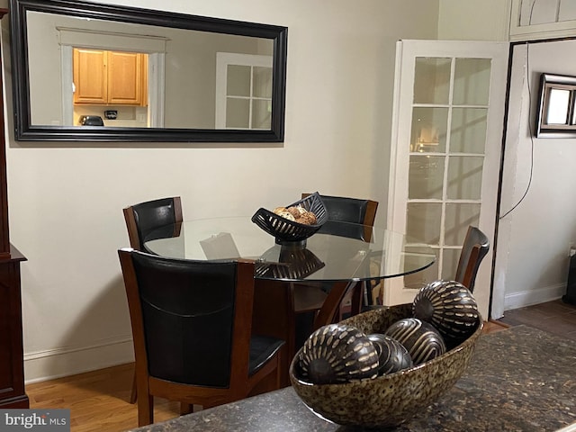 dining space featuring hardwood / wood-style floors