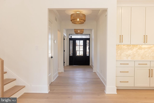 doorway to outside with light hardwood / wood-style flooring