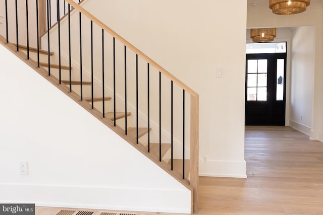 staircase featuring hardwood / wood-style floors