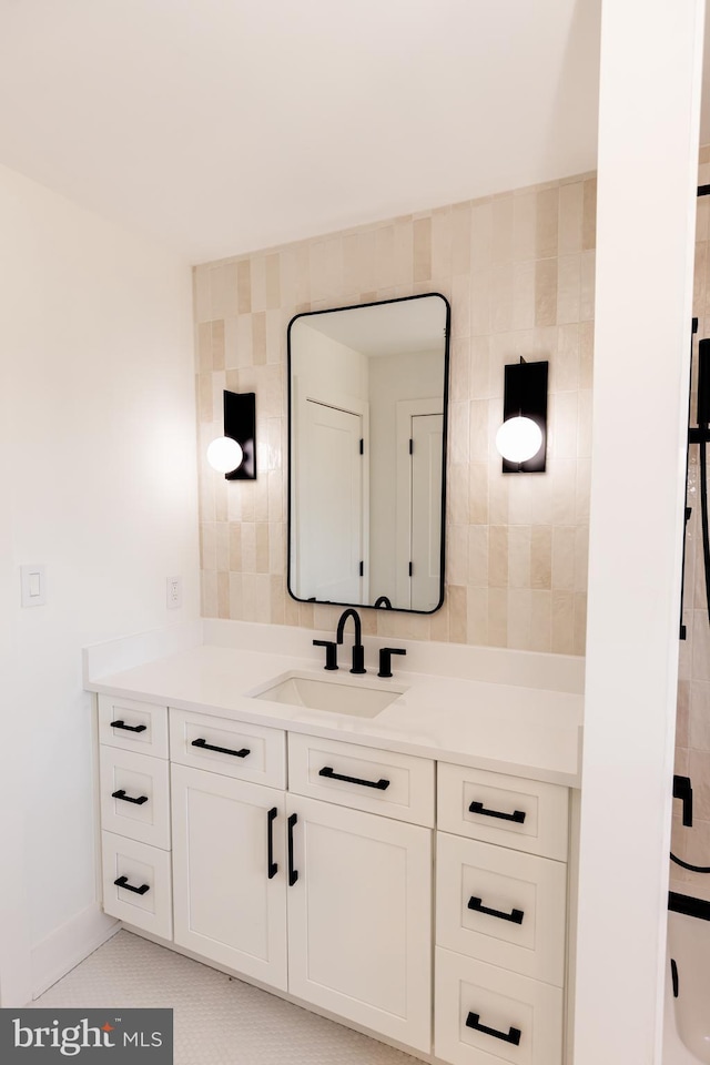 bathroom with tile patterned flooring and vanity