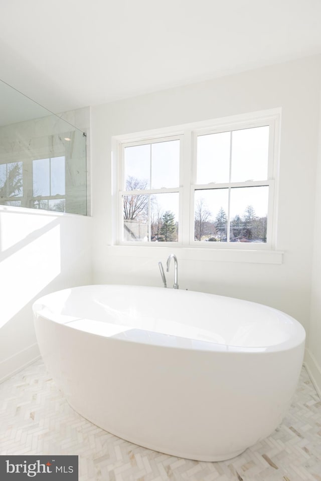 bathroom featuring a tub to relax in