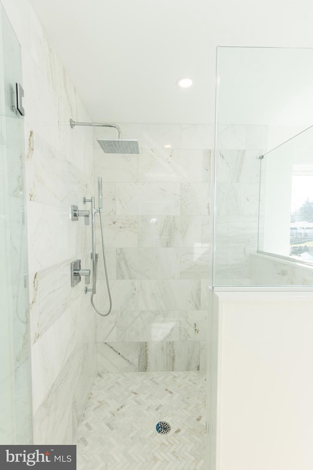 bathroom with tiled shower