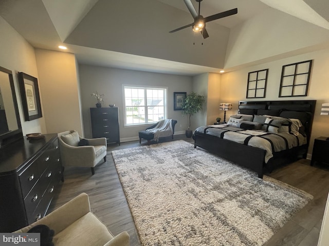 bedroom featuring high vaulted ceiling, ceiling fan, and dark wood-type flooring