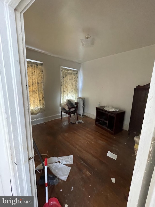 interior space featuring radiator and dark hardwood / wood-style flooring