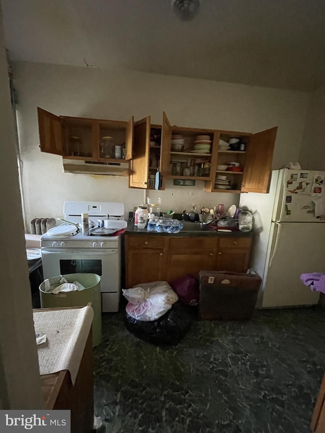 kitchen with white appliances and extractor fan