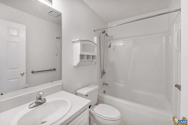 full bathroom featuring vanity, a textured ceiling, toilet, and washtub / shower combination