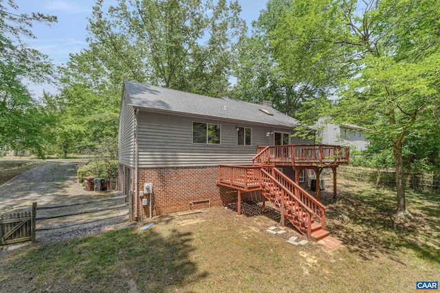 back of house featuring a deck