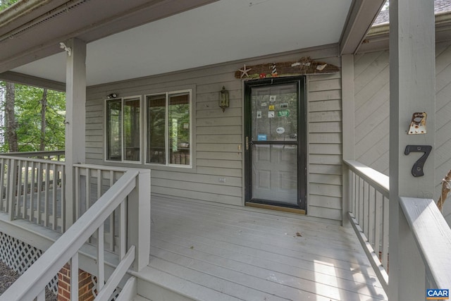 wooden terrace featuring a porch