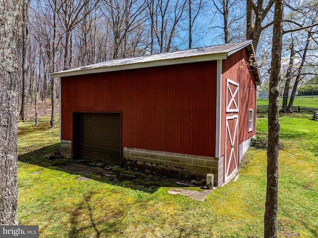 view of outdoor structure with a lawn