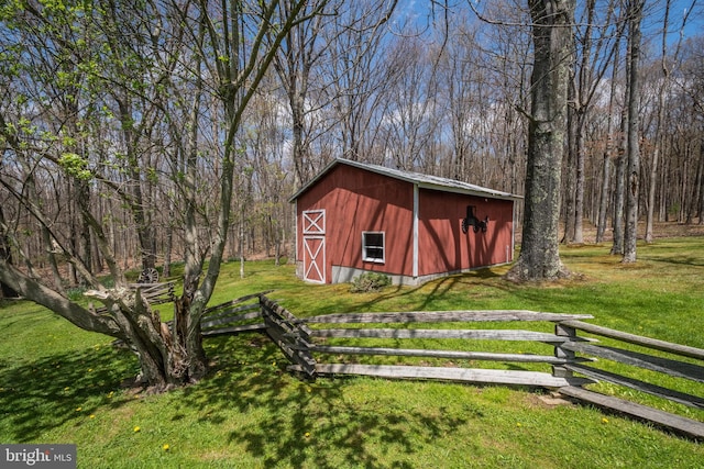 view of outbuilding with a lawn