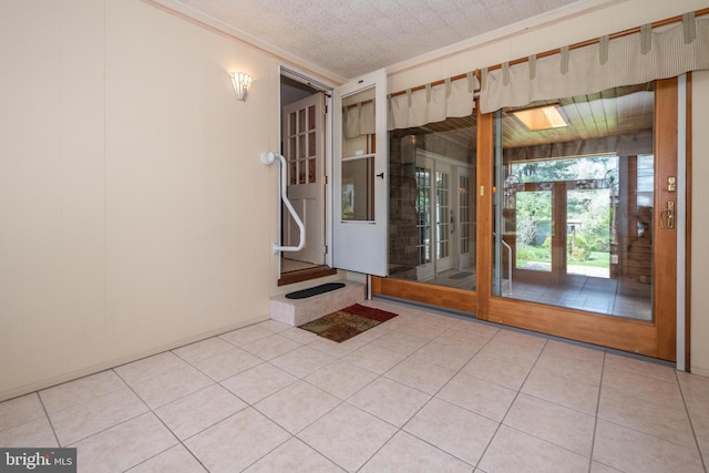 tiled empty room with french doors