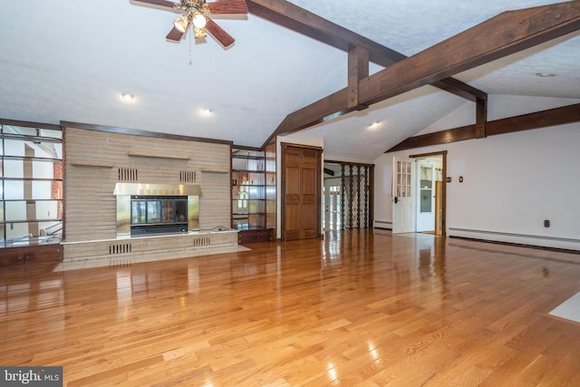 unfurnished living room with a fireplace, ceiling fan, vaulted ceiling, a baseboard radiator, and light hardwood / wood-style flooring