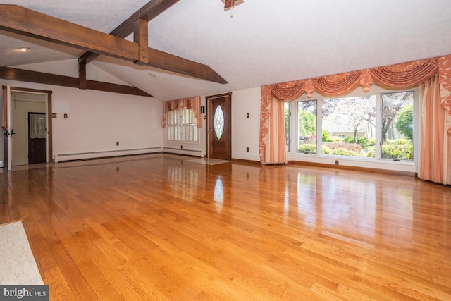 unfurnished living room featuring a baseboard heating unit, light hardwood / wood-style floors, and vaulted ceiling with beams